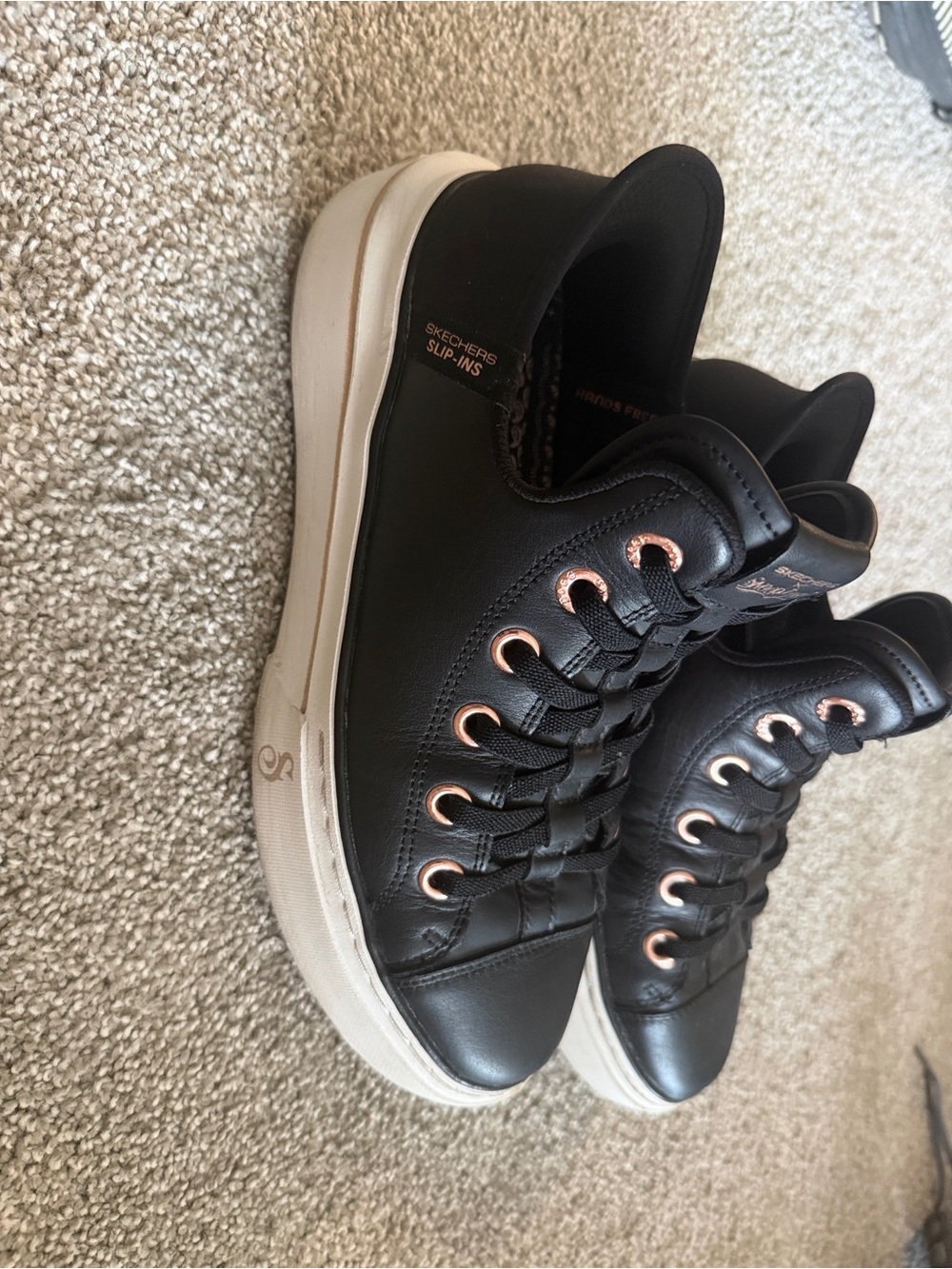 Skechers Black Slip-On Sneakers with Rose Gold Eyelets and White Sole